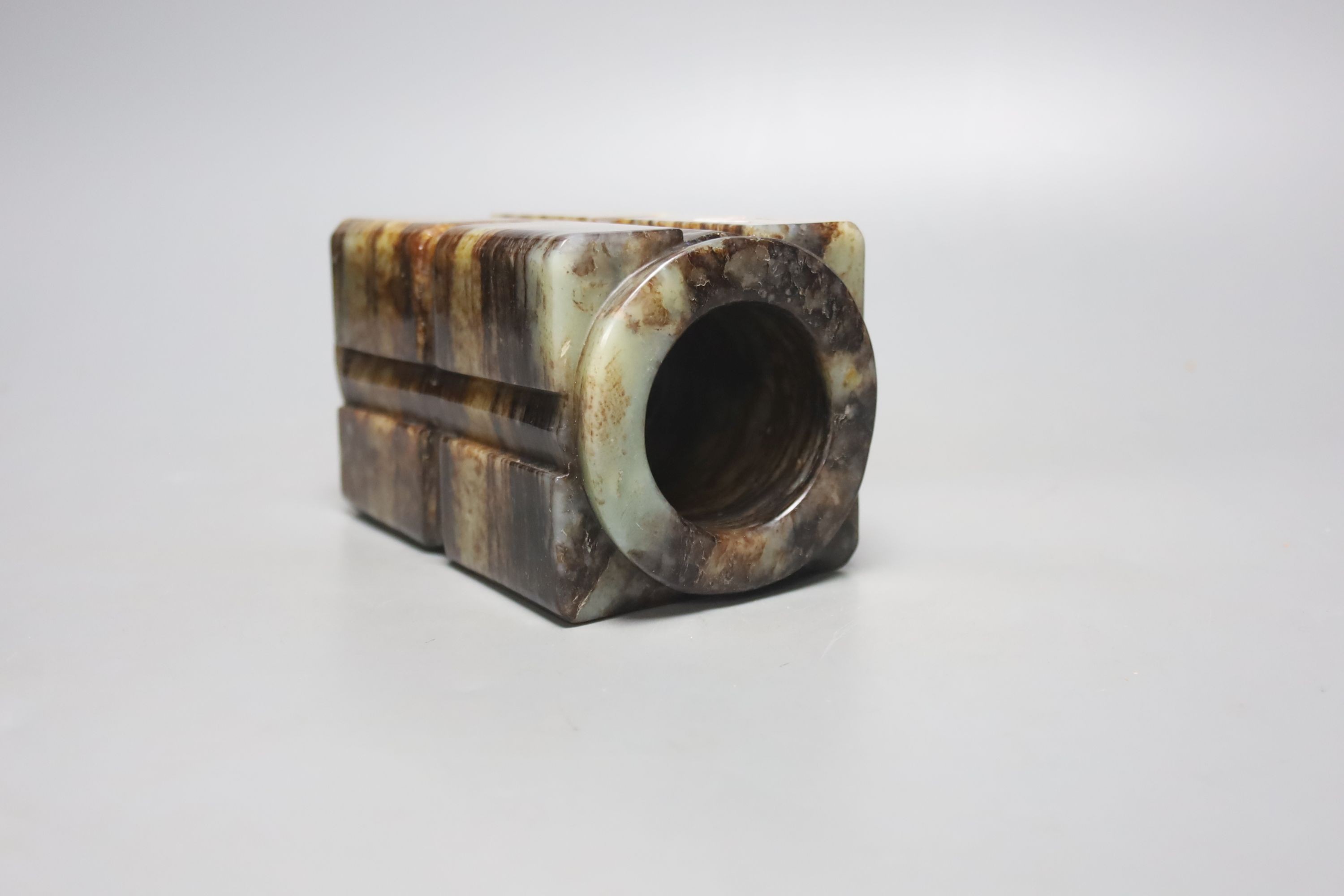 A Chinese pale celadon and black jade cong, H. 14cm